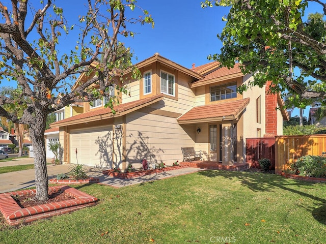 view of front of property featuring a garage and a front yard