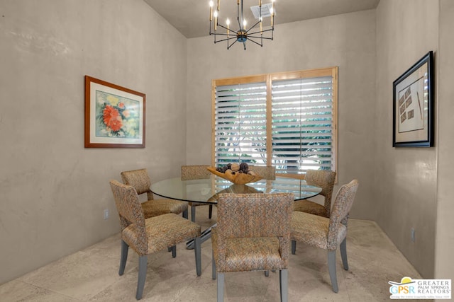 dining space featuring an inviting chandelier