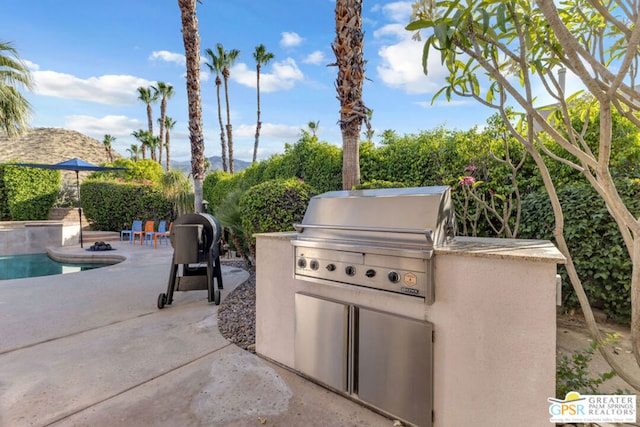 view of patio with a grill and exterior kitchen