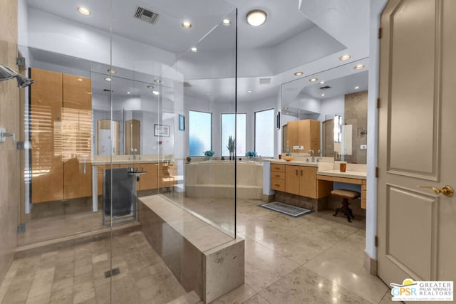 bathroom featuring vanity and a shower with shower door