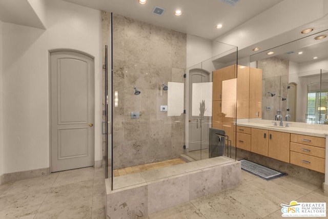 bathroom featuring vanity and walk in shower