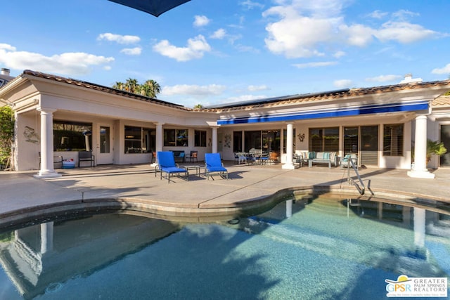 view of swimming pool featuring an outdoor living space and a patio