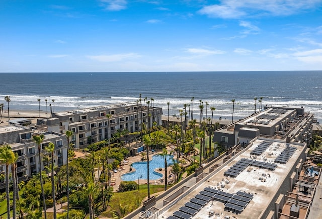 drone / aerial view featuring a water view and a view of the beach