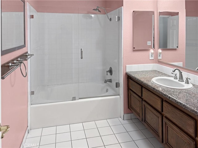 bathroom featuring tile patterned floors, shower / bath combination with glass door, and vanity