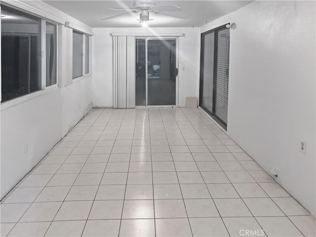 interior space featuring ceiling fan and light tile patterned floors