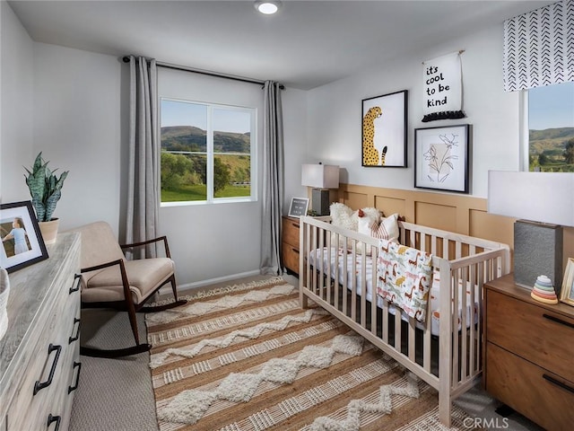 bedroom with a nursery area