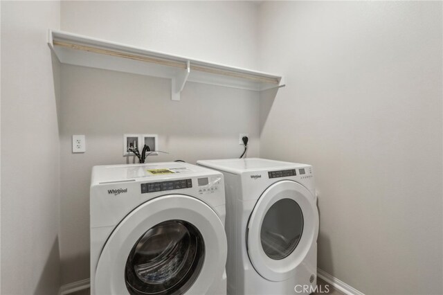 laundry room with washer and dryer