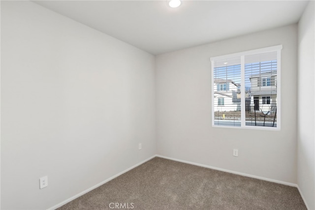 unfurnished room featuring carpet floors