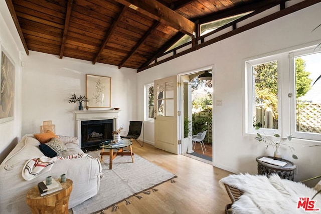 living room featuring vaulted ceiling with beams, wood ceiling, and light hardwood / wood-style flooring