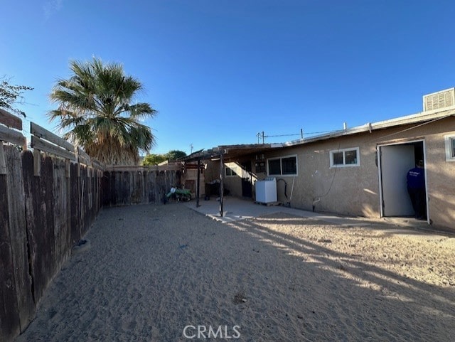 back of house featuring a patio area and central AC unit