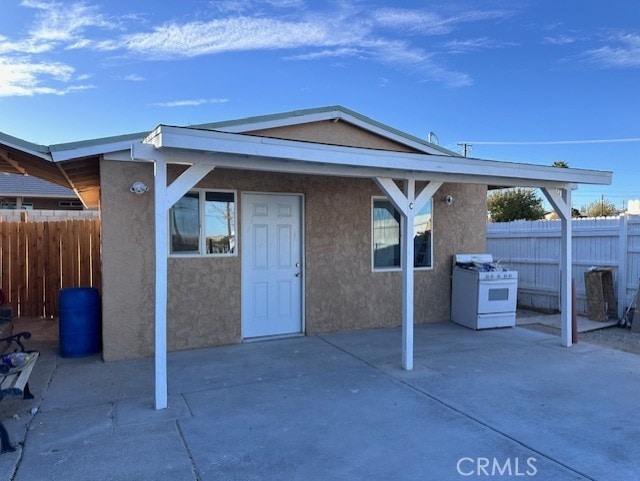 rear view of house featuring a patio area