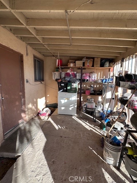 interior space with concrete flooring and washer / clothes dryer