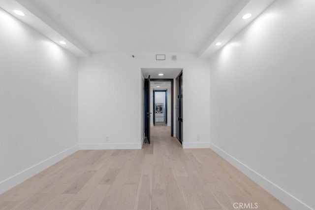 spare room featuring light hardwood / wood-style floors