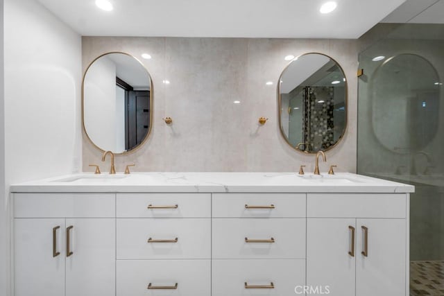 bathroom with vanity and an enclosed shower