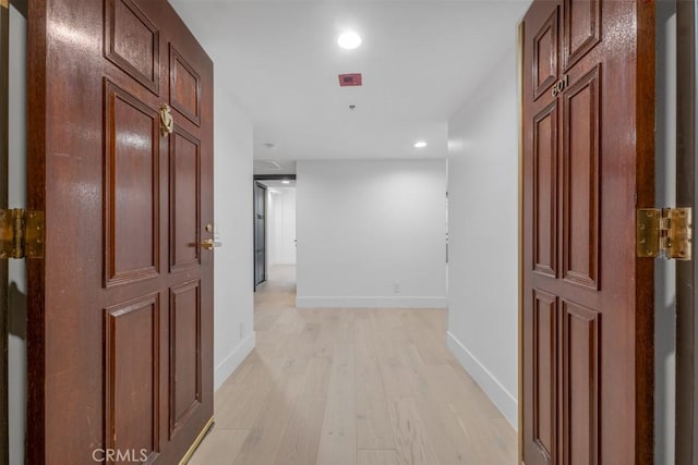 hallway with light wood-type flooring