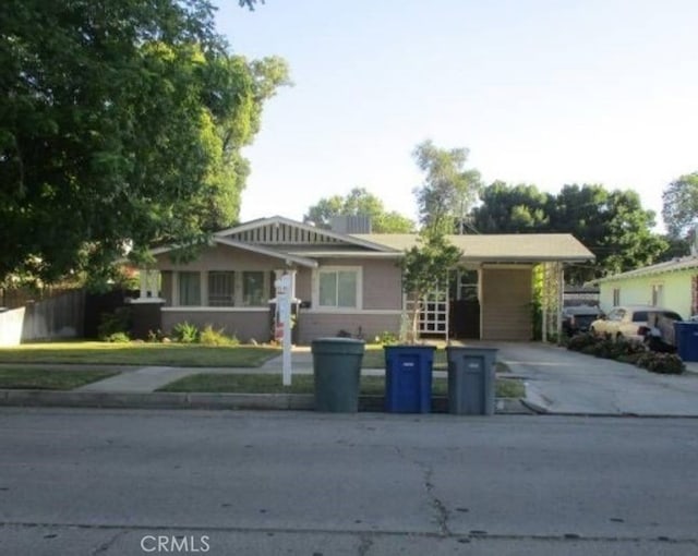 view of front of house featuring a carport