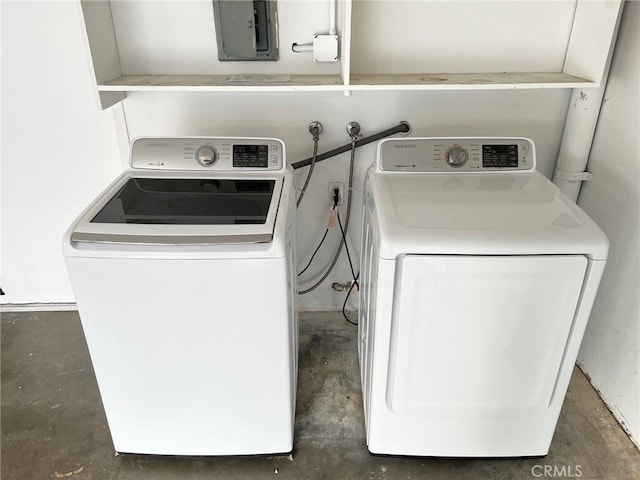 washroom with washing machine and dryer and electric panel