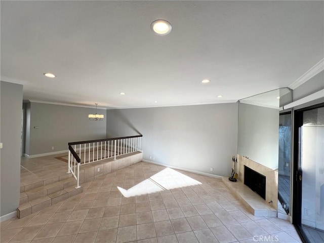 unfurnished living room with a notable chandelier, crown molding, light tile patterned floors, and a fireplace