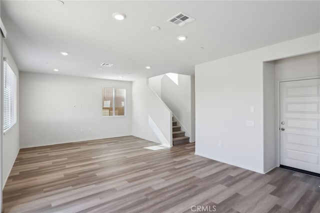 unfurnished room with light hardwood / wood-style flooring