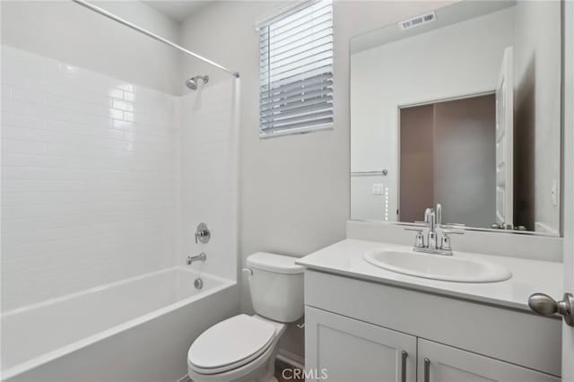 full bathroom with vanity, shower / bathtub combination, and toilet