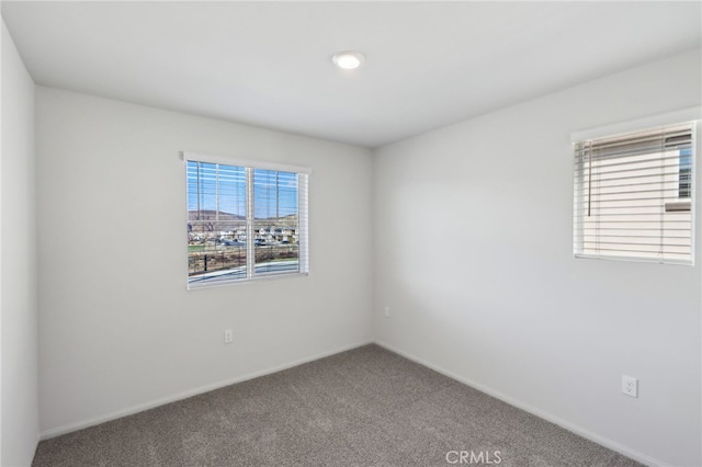 spare room with carpet flooring