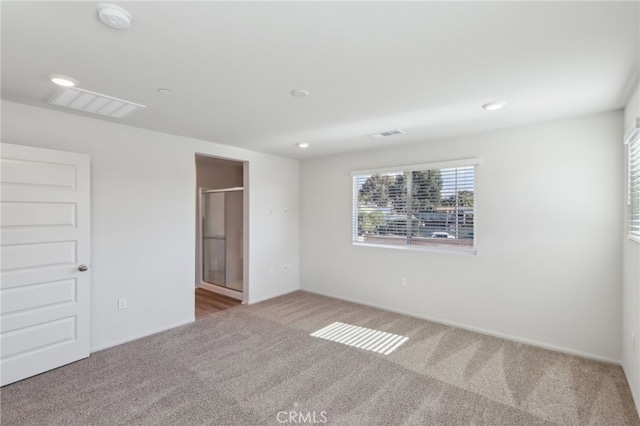 spare room featuring carpet flooring