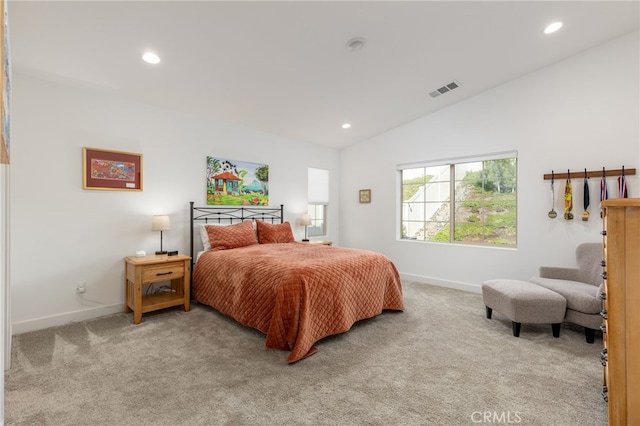 bedroom with light carpet and vaulted ceiling