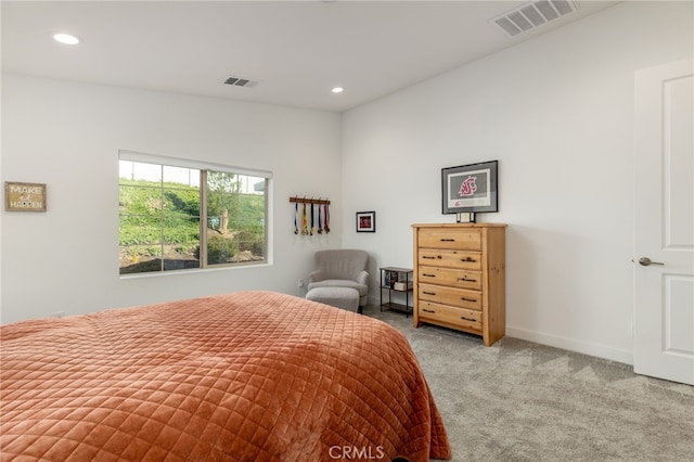 bedroom featuring light carpet