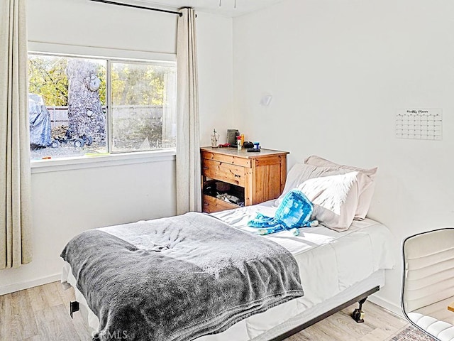 bedroom with light hardwood / wood-style floors