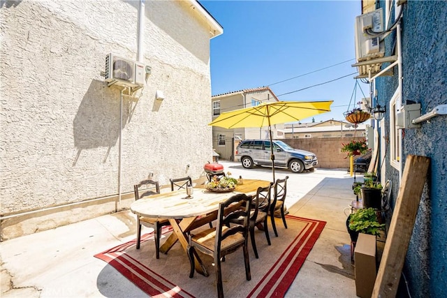 view of patio / terrace featuring a wall mounted air conditioner