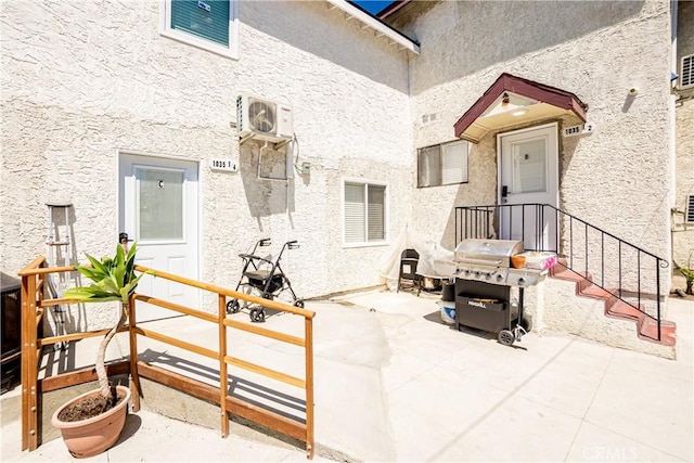 view of patio / terrace featuring ac unit and area for grilling