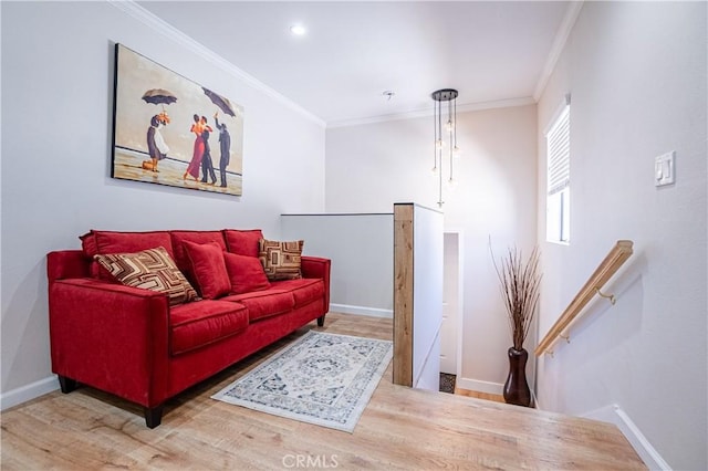 living room with wood-type flooring and ornamental molding