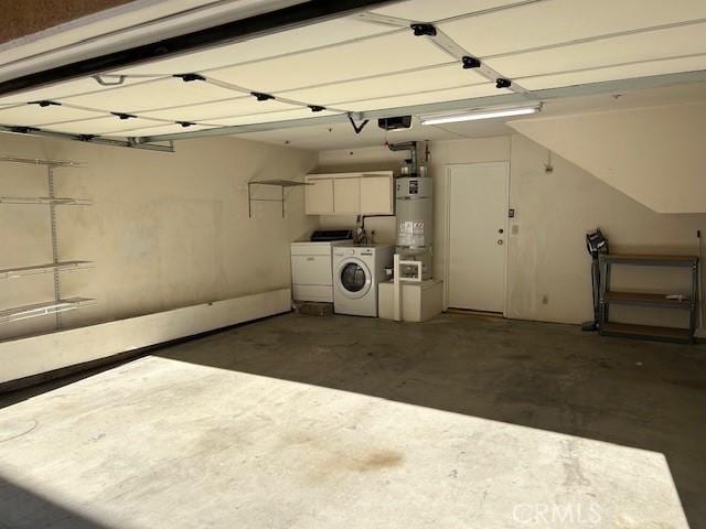 garage featuring strapped water heater, a garage door opener, and washing machine and clothes dryer