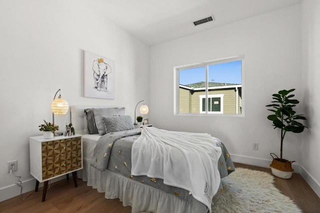 bedroom featuring wood-type flooring