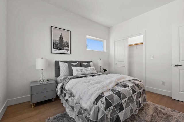 bedroom featuring hardwood / wood-style flooring and a closet