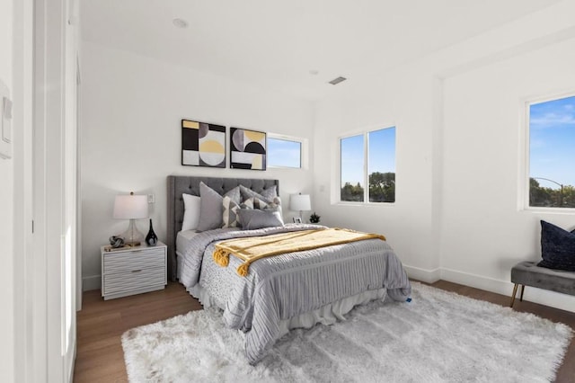 bedroom with hardwood / wood-style floors