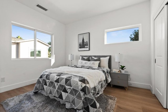 bedroom featuring hardwood / wood-style flooring and a closet