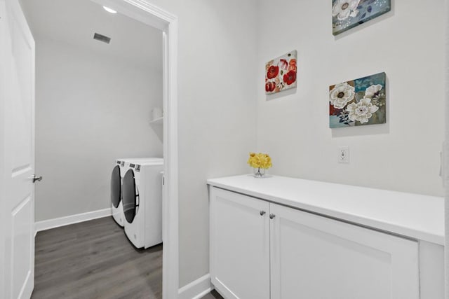 laundry area featuring independent washer and dryer and hardwood / wood-style floors