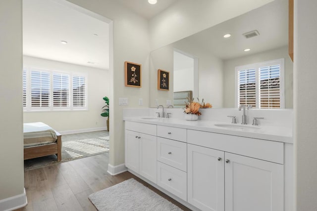 bathroom featuring vanity and wood-type flooring