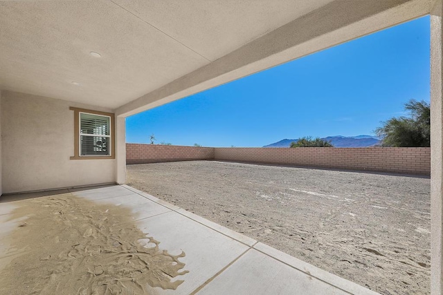 view of patio / terrace featuring a mountain view