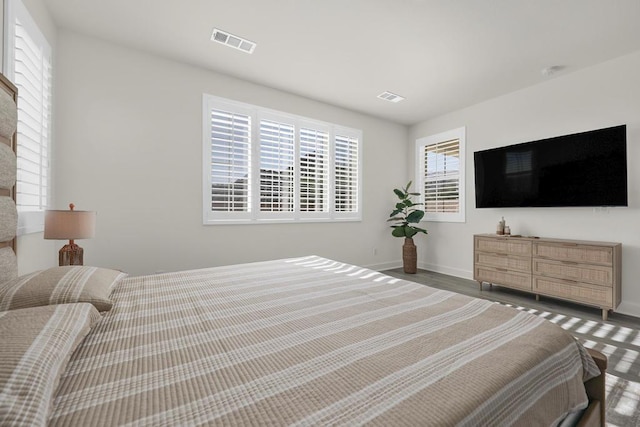 bedroom with dark wood-type flooring