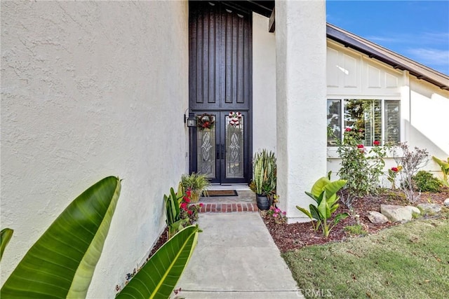 view of exterior entry featuring french doors