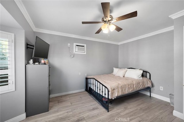 bedroom with light wood-type flooring, a wall unit AC, ceiling fan, and crown molding