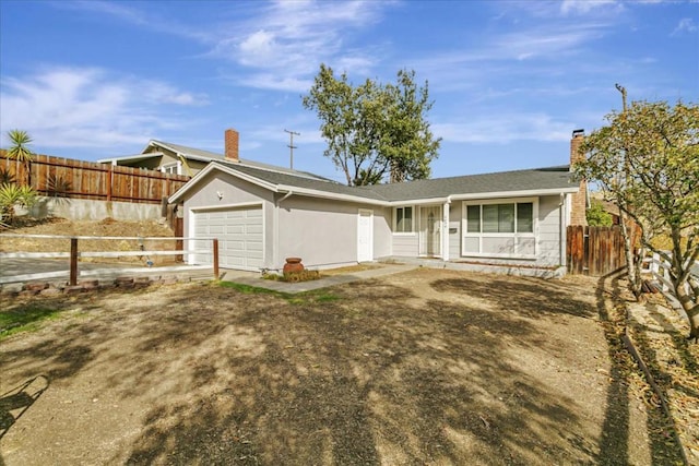 ranch-style home featuring a garage