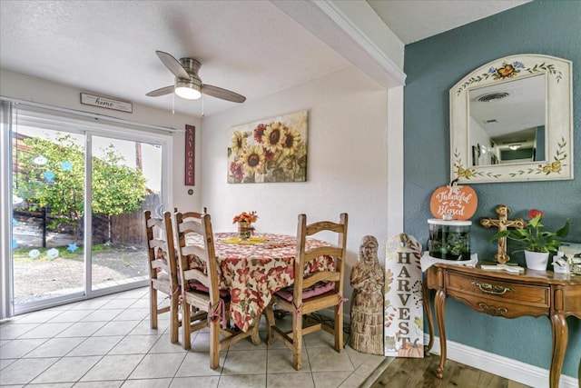 dining room with ceiling fan and light tile patterned flooring