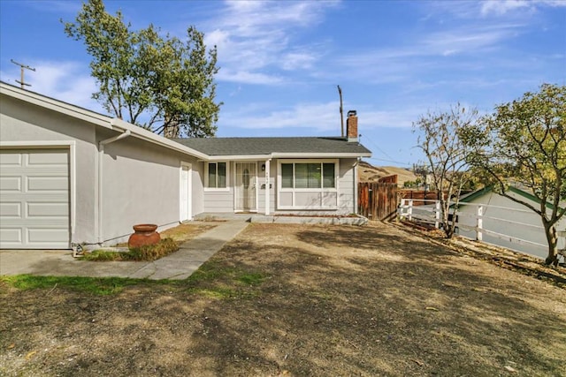 ranch-style house featuring a garage