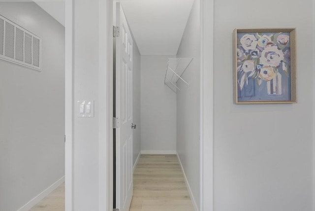 walk in closet featuring light wood-type flooring