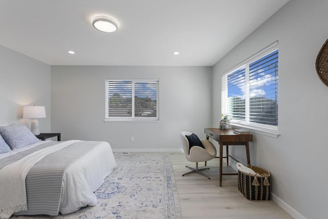 bedroom with light hardwood / wood-style flooring