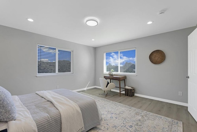 bedroom with hardwood / wood-style flooring