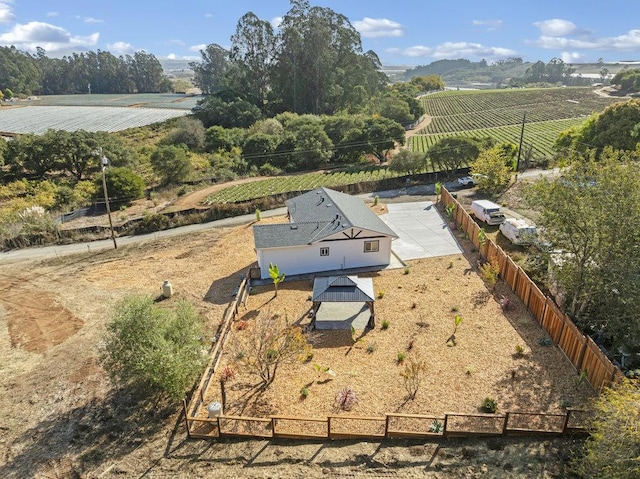 birds eye view of property with a rural view